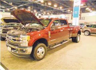  ??  ?? A Ford heavy-duty truck is showcased at a New Mexico Internatio­nal Auto Show.