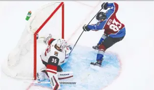  ?? SERGEI BELSKI/USA TODAY SPORTS ?? Arizona Coyotes goaltender Darcy Kuemper stops Colorado Avalanche left-winger Matt Nieto in Game 1 on Wednesday. The Avs outshot the Coyotes 40-14 in their 3-0 victory.