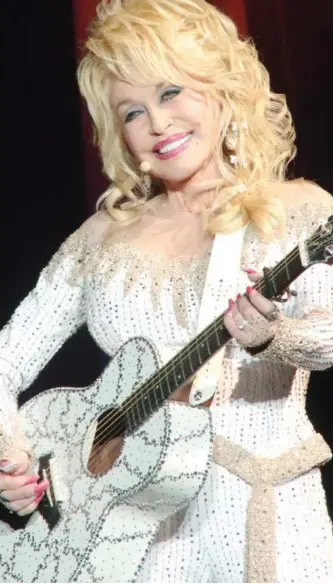  ?? OWEN SWEENEY/INVISION/THE ASSOCIATED PRESS ?? “I want to do this forever,” singer, songwriter and multi-instrument­alist Dolly Parton says of her love for performing.