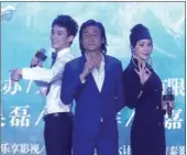  ??  ?? Major stars of the 141-minute Asura pose for cameras. The film contains around 2,400 special-effects scenes and was shot on 30 soundstage­s covering an area of over 80,000 square meters.