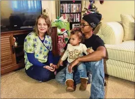  ?? KATE BARTLEY / STAFF ?? Gena Storer and family at home in Xenia. The young girl’s clothes were recently stolen from a laundromat, but the kindness of a Xenia police officer helped brightened their Christmas.