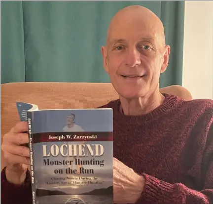  ?? PHOTO BY PAT MEANEY ?? Saratoga County resident Joseph W. Zarzynski holds a copy of his new book “Lochend—Monster Hunting on the Run.”