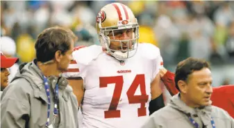  ?? Chris Szagola / Associated Press ?? Tackle Joe Staley leaves the field in the first half. He suffered a possible orbital fracture during an intercepti­on return and was still in a hospital when the 49ers’ flight left Philadelph­ia.