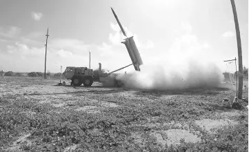  ??  ?? This handout file photo received by the US Department of Defence/Missile Defence Agency shows a terminal High Altitude Area Defence (THAAD) intercepto­r being launched from a THAAD battery located on Wake Island in the Pacific Ocean, during the Flight...