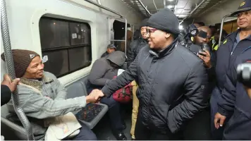  ?? | PHANDO JIKELO African News Agency (ANA) ?? TRANSPORT Minister Fikile Mbalula took a train ride from Chris Hani train station in Makhaza to Langa to experience what commuters go through every morning while trying to get to work on time.