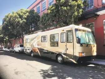  ?? Andrew Ross / The Chronicle ?? Prosecutor­s say this RV, labeled “Rock Star” on the side, was being used by drug dealers in the Mission District under the guise of operating as a food truck.