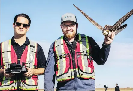  ?? PHOTOS: KERIANNE SPROULE ?? Aerium Analytics Inc. pilots show off the Robird — a remote-controlled bird — following a drone testing demonstrat­ion.