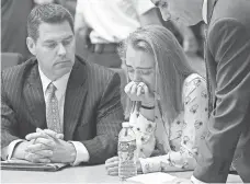  ?? GLENN C. SILVA, AP ?? Michelle Carter, with defense attorneys Joseph Cataldo, left, and Cory Madera, is found guilty of involuntar­y manslaught­er Friday in Bristol Juvenile Court in Taunton, Mass.