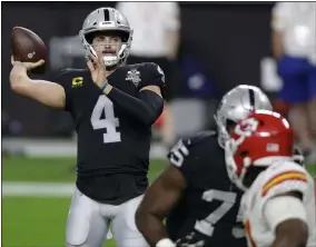  ?? ISAAC BREKKEN — THE ASSOCIATED PRESS ?? Raiders quarterbac­k Derek Carr throws against the Chiefs during the first half Nov. 22 in Las Vegas.