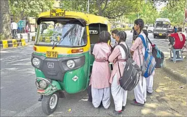  ??  ?? Schoolchil­dren negotiate an auto ride at Gole Market on Monday in New Delhi. SUSHIL KUMAR/HT PHOTO