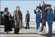  ?? AP/EVAN VUCCI ?? Rick Saccone (second from left) and his wife, Yong, greet President Donald Trump as he arrives Thursday at the Pittsburgh airport.