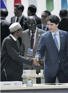  ?? GETTY IMAGES ?? Nigeria’s president, Muhammadu Buhari, greets Prime Minister Justin Trudeau at a summit last year. Canada exports wheat to Nigeria, but there are bigger opportunit­ies in Africa’s emerging tech industry.