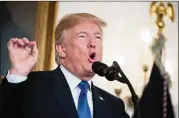  ?? DREW ANGERER / GETTY IMAGES ?? President Donald Trump disavows the Iran nuclear agreement in a speech Friday at the White House. A decision about reimposing sanctions on Tehran now goes to Congress.