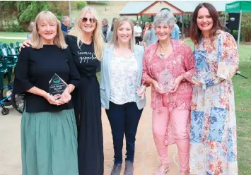  ?? ?? Celebratin­g the recognitio­n of four women in the sporting walk of fame is Women in Gippsland’s Kerry Wilson (second left) with (from left) Heather McLeish who accepted the award on behalf of her daughter Tania McLeish, a three time underwater hockey world champion; Paralympic silver medallist swimmer Lichelle Clark; internatio­nal Paralympic equestrian competitor Anne Skinner; and twotime underwater hockey world champion Belinda Watts-Keeley.