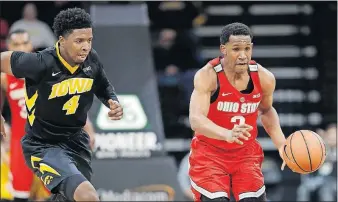  ?? [CHARLIE NEIBERGALL/THE ASSOCIATED PRESS] ?? Ohio State guard C.J. Jackson drives upcourt after stealing the ball from Iowa guard Isaiah Moss during the second half.