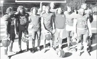  ?? Submitted Photo ?? The Forrest City Mustangs played their final season game Friday, a 32-30 loss to visiting Brookland. It was the final game for eight of the Mustang seniors who will be graduating in May. Following the game, the seniors posed for this photo under the north endzone with head coach Ronald Lewis.