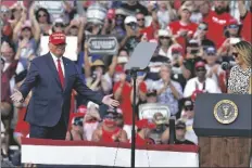  ?? ASSOCIATED PRESS ?? PRESIDENT DONALD TRUMP gestures as he is introduced by first lady Melania Trump during a campaign rally Thursday in Tampa, Fla.