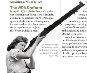  ??  ?? A WRNS officer examines a rifle during her training as an armourer in
July 1942