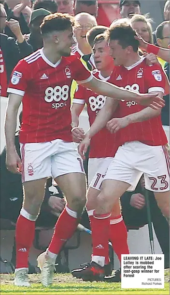  ?? PICTURES: Richard Parkes ?? LEAVING IT LATE: Joe Lolley is mobbed after scoring the last-gasp winner for Forest