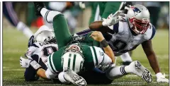  ??  ?? AP file photo Mark Sanchez (center) knows that, fairly or not, his name will always be associated with “The Butt Fumble.”