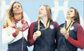  ?? PICTURE: REUTERS ?? Americans Lily King and Katie Meili, and Yulia Efimova of Russia with their medals following the women’s 100m breaststro­ke final on Monday.