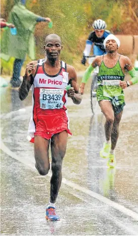  ?? /Darren Stewart/Gallo Images ?? Close run: Marko Mambo leads the field at the 2012 Two Oceans Marathon. Mambo has come the closest to breaking Thompson Magawana’s record of 3hr 3min 44sec, set in 1988. The Zimbabwean ran 3:05:39 in 2005.