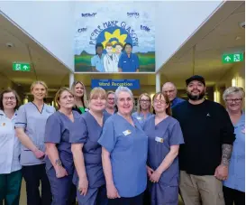  ?? ?? Staff at Marie Curie Hospice in Glasgow with artist EJEK at the new mural