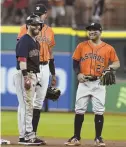  ?? AP FILE PHOTO ?? COMING FOR SECONDS: Dustin Pedroia and the Astros’ Jose Altuve will certainly be smiling if their teams avoid the rampaging Indians.