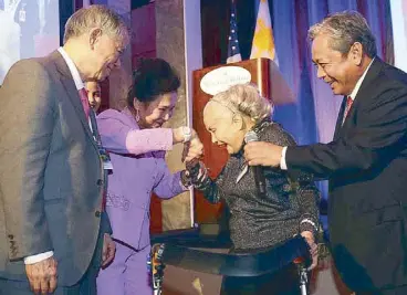  ??  ?? Rebecca “Becky”Verzosa-Santos with PAL chairman Dr. Lucio C. Tan with his wife Carmen, and PAL president Jaime J. Bautista during a dinner-reception celebratin­g the flag carrier’s return to New York in March 2015. Becky received a standing ovation...