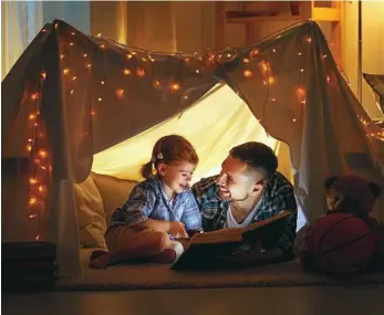  ?? PHOTO: EVGENYATAM­ANENKO ?? COSY WINTER: Rug up with your little ones or build a snug pillow fort or blanket cubby, then spend time reading with them in the warmth.