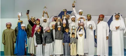  ?? Supplied photo ?? Winners of Fazza Falconry Championsh­ip pose for a group photo. Kids as young as three years old participat­ed in the contest. —