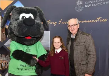  ??  ?? Cliodhna Hannify, Monksland NS who won 2nd place in the Greener Christmas Poetry 2019 competitio­n (Dundalk Municipal District) rwith Seamus Savage, Tidy Towns at the awards ceremony held in the Presentati­on Primary NS, Drogheda.