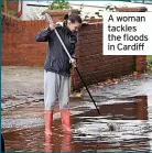  ?? ?? A woman tackles the floods in Cardiff