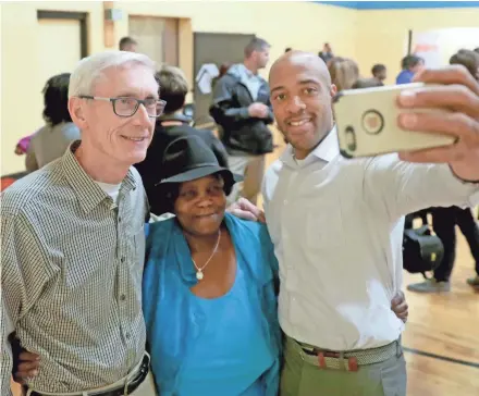  ?? MIKE DE SISTI / JOURNAL SENTINEL ?? Gov.-elect Tony Evers (left) and Lt. Gov.-elect Mandela Barnes take a selfie with Linda Hoskins, the mother of state Rep.-elect Shelia Stubbs (D-Madison) after they visited the Boys &amp; Girls Club Wednesday.