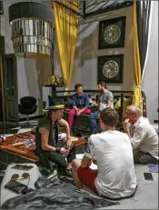  ?? JOSÉ JIMÉNEZ-TIRADO / THE NEW YORK TIMES ?? Brock Pierce (left) sits with Josh Boles and Robert Anderson (right) last month in San Juan, Puerto Rico’s Monastery hotel, home base for their cryptocurr­ency business.