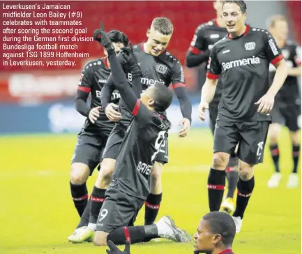  ??  ?? Leverkusen’s Jamaican midfielder Leon Bailey (#9) celebrates with teammates after scoring the second goal during the German first division Bundesliga football match against TSG 1899 Hoffenheim in Leverkusen, yesterday.