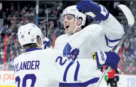  ?? SEAN KILPATRICK/THE CANADIAN PRESS ?? Toronto Maple Leafs centre Auston Matthews celebrates a first period goal with teammate William Nylander during NHL hockey action in Ottawa on Wednesday, Oct. 12. From Day 1 of the NHL to the four-goal debut of Matthews, there is no shortage of...