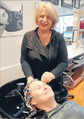  ??  ?? Hair today: After 41 years in business, Tawa Haircraft Centre’s Maureen Bowring has many long-term clients such as Katrina Randerson.