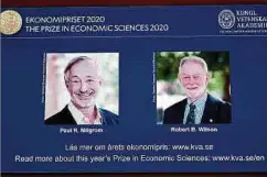  ?? Foto: AFP ?? Eingeblend­et auf die Tafel der diesjährig­en Preisträge­r: Die Forscher Paul Milgrom (li.) und Robert Wilson.