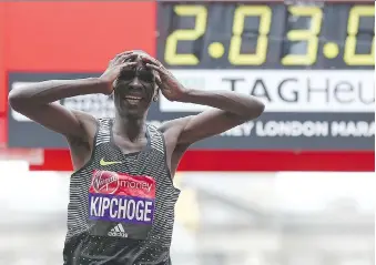 ?? JUSTIN TALLIS/GETTY IMAGES/FILES ?? Kenya’s Eliud Kipchoge finished the 2016 London Marathon in a time of 2:03.05, seconds shy of the world record of 2:02:57 set by fellow Kenyan Dennis Kimetto at the Berlin Marathon. Runners around the world are trying to break the two-hour marathon mark.
