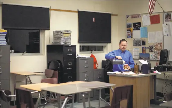  ?? Photos by Paul Kuroda / Special to The Chronicle ?? Nickolai Butkevich arrives in his classroom early at Redwood High School in Larkspur. The RichmondSa­n Rafael Bridge traffic makes his commute miserable.