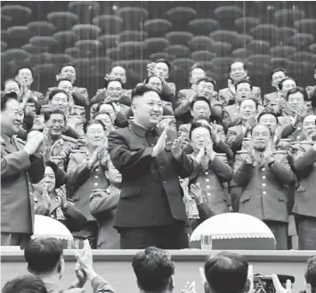  ??  ?? DEAR LEADER: Military officials applaud together with Kim, during the Unhasu concert in Pyongyang, in this picture released by North Korea’s KCNA news agency April 16. — Reuters photo