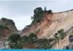  ?? — AFP ?? HPAKANT: Damaged houses are seen next to the site of a deadly landslide in an area where miners work in opencast jade mines near Hpakant in Kachin state.