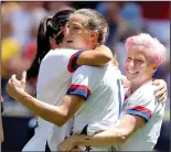  ?? ELSA/GETTY IMAGES/TNS ?? Tobin Heath (17) of the United States is congratula­ted by teammates Megan Rapinoe, right, and Alex Morgan after a goal against Mexico on May 26 in Harrison, N.J.