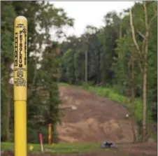  ?? DIGITAL FIRST MEDIA FILE PHOTO ?? A marker for Sunoco Pipeline L.P. sits along a barren ridge that was cleared for constructi­on of the Mariner East 2 pipeline in Middletown last month.