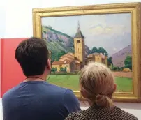  ?? Le clocher de Ria AFP ?? Visitors look at the painting (The bell tower of Ria) at the museum dedicated to painter Etienne Terrus in Elne. —