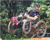  ?? ?? Jonathan Simek and Jayce Cunning compete in the Speed s Style competitio­n (left); and Grant Allen testing an adaptive mountain bike for all abilities on the slalom track