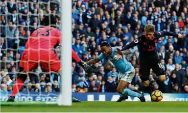  ??  ?? Spot of bother: Manchester City’s Raheem Sterling is brought down by Arsenal’s Nacho Monreal resulting in a penalty. — Reuters