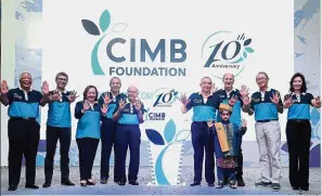  ??  ?? Top management: (from left) Datuk Mohd Shukri Hussin, CIMB Foundation board of trustee (BoT); Zafrul; Rosnah Kamarulzam­an, BoT; Md Nor; Tan Sri G.K. Rama Iyer, BoT; Nazir; Datuk Dr Richard Leete, BoT; Datuk Robert Cheim, BoT and Hamidah at the CIMB...