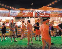  ?? Chase Stevens ?? Las Vegas Review-journal Follow @csstevensp­hoto Attendees check out food vendors at last year’s festival.